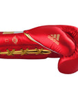 Red boxing glove with gold laces, adidas Adi-Speed 501 series.