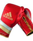 Pair of adidas Adi-Speed 500 boxing gloves in red and white.