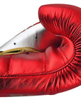 Red boxing glove, adidas Adi-Speed 501, close-up view.