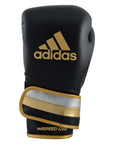 Black and gold Adidas boxing glove, metallic black, gold, silver, 12 oz.