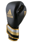 Black and gold Adidas boxing glove, metallic gold, black, silver, 18 oz.