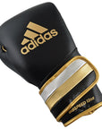 Black and gold Adidas boxing glove, metallic black, gold, silver, 8 oz.