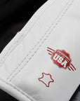 White leather boxing glove with red logo.