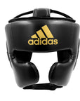 Black boxing helmet with a gold Adidas logo.