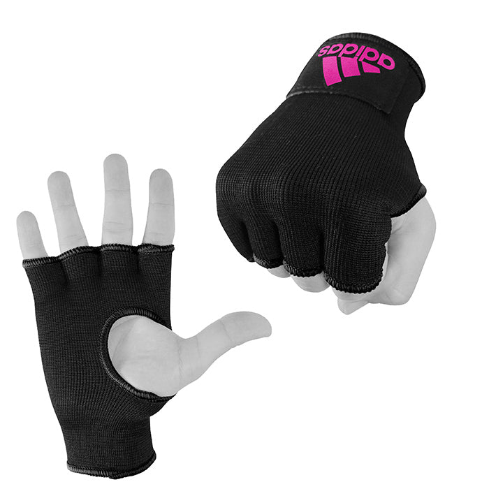 Black gloves on hand for boxing protection.