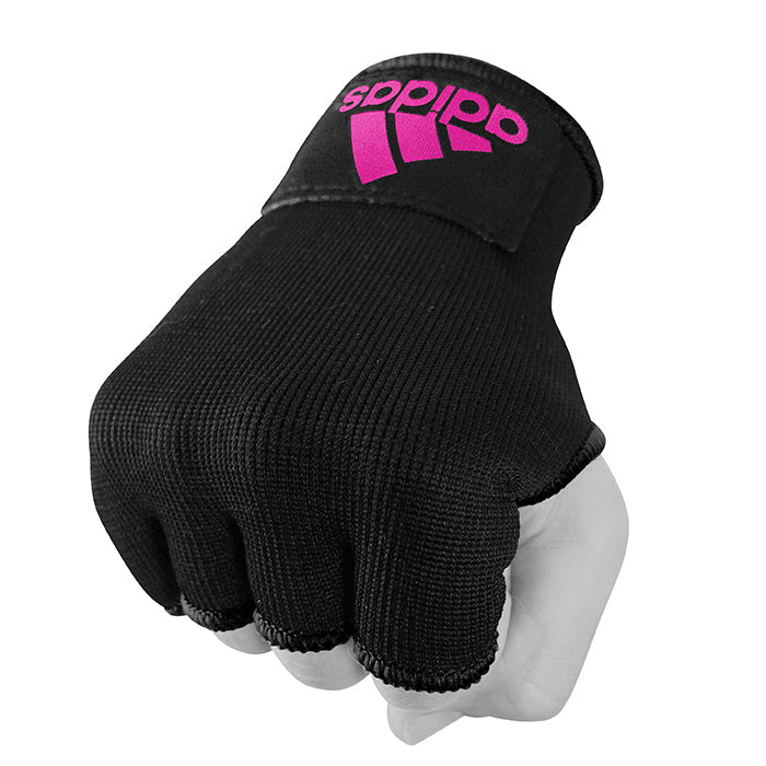 Hand wearing black boxing glove, extra small size.