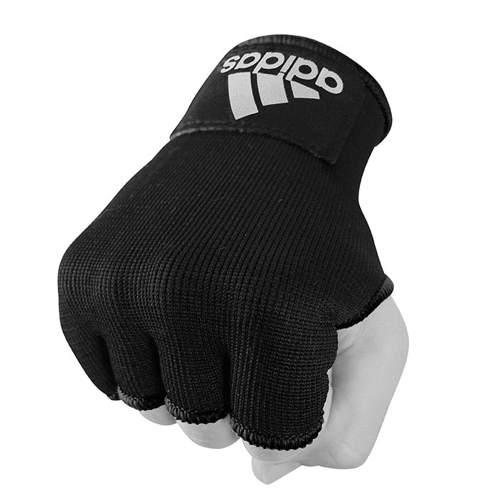 Black adidas boxing hand wrap gloves on a hand.