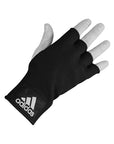 Black adidas boxing hand wrap glove worn on hand.