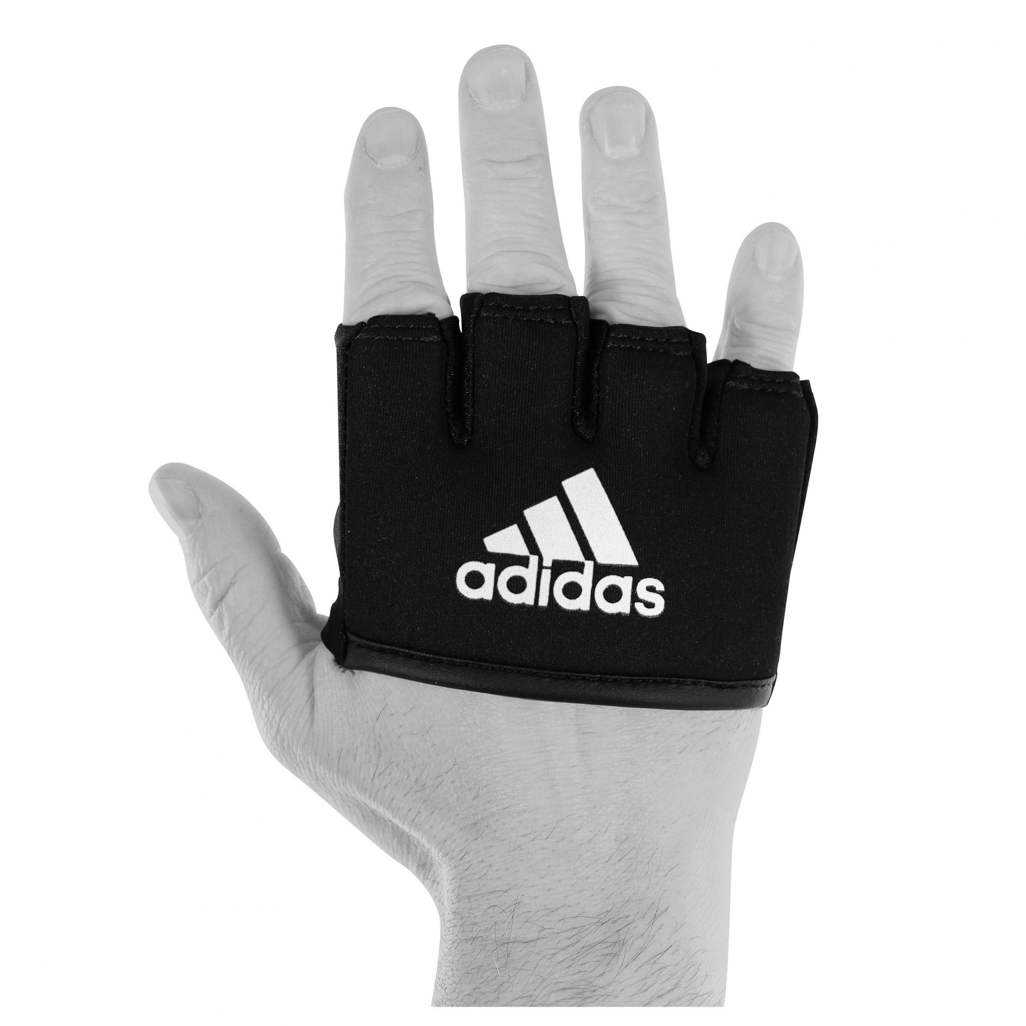 Hand wearing black adidas boxing knuckle protection glove.