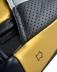 Close up of a black and gold Adidas boxing glove.