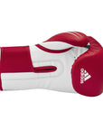 Red and white boxing glove for training.