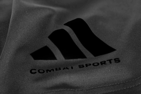 Close-up of Adidas logo on a Dri-Fit t-shirt.