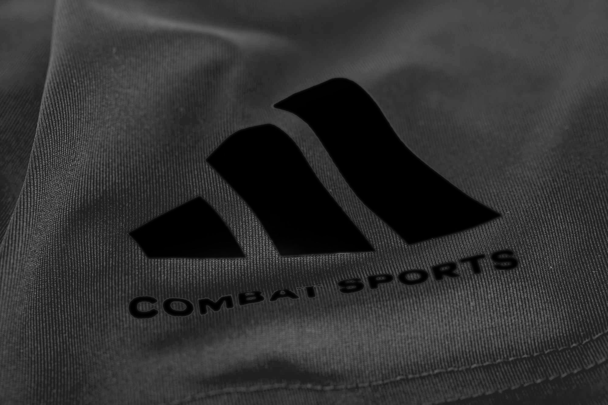 Close-up of logo on adidas Combat Sports Drifit T-shirt, Taekwondo apparel.