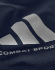 Close-up of white logo on a blue Dri-Fit t-shirt.