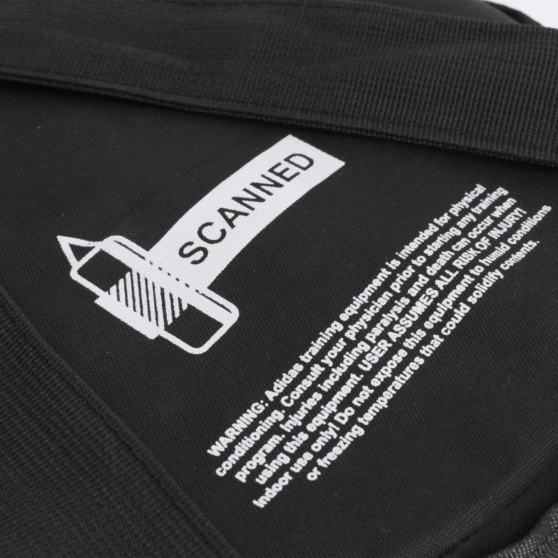 Black Adidas bag with white writing for boxing training.