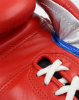 Close up of a red boxing glove.