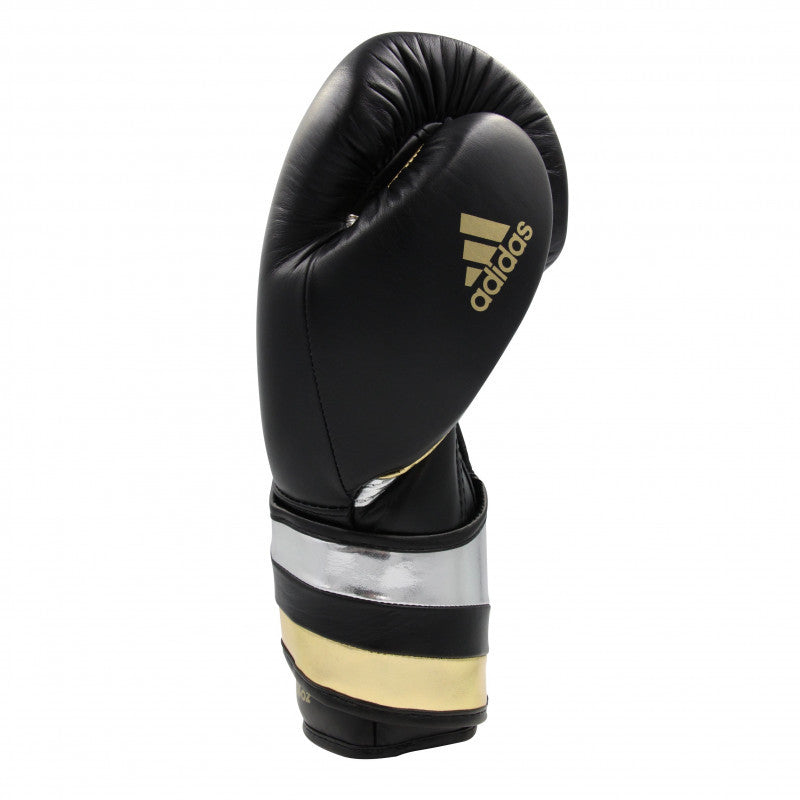 Black and gold adidas boxing glove, 14 oz, for men and women.