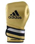 Gold boxing glove with black and white stripes for boxing or kickboxing.