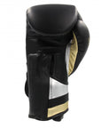 Black and gold adidas boxing glove, 16 oz, for men and women.