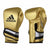 Pair of gold Adidas Adi-Speed boxing gloves for men and women.