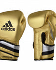 Pair of gold Adidas Adi-Speed boxing gloves for men and women.