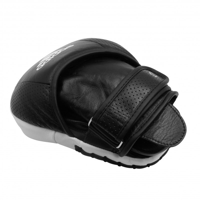 A black and white boxing glove designed for focus mitt training.