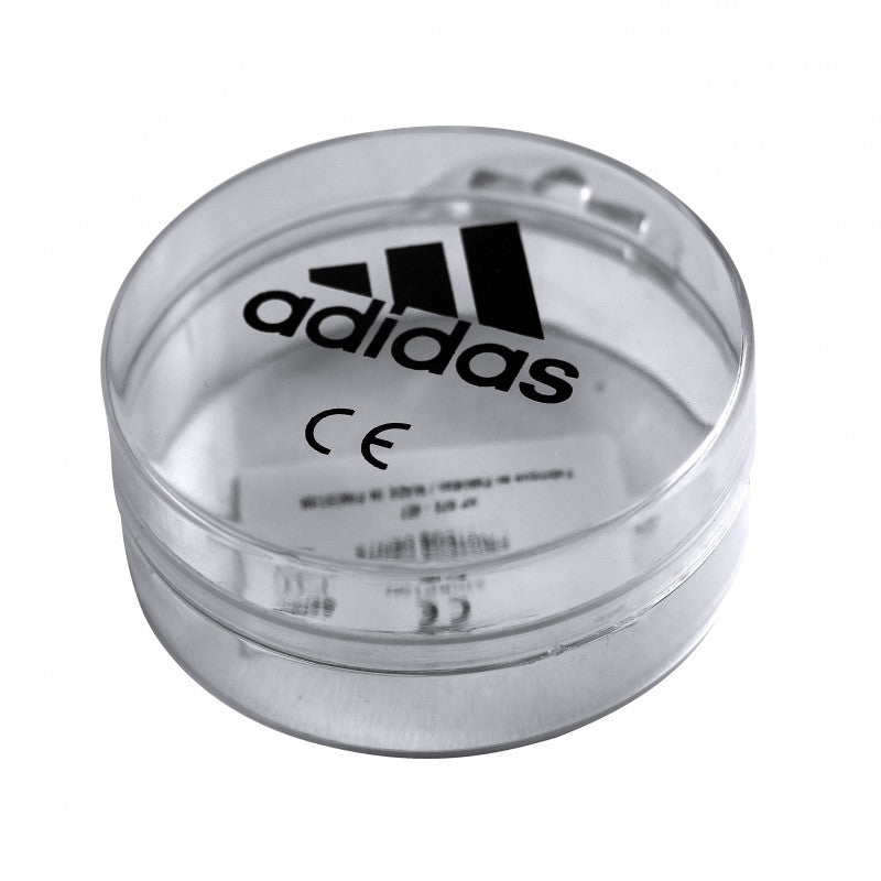 Clear plastic container with Adidas logo.