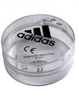 Clear plastic container with Adidas logo.