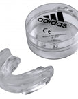 Clear plastic Adidas mouthguard, protective boxing gear.