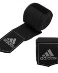 A pair of black wrist wraps for boxing.