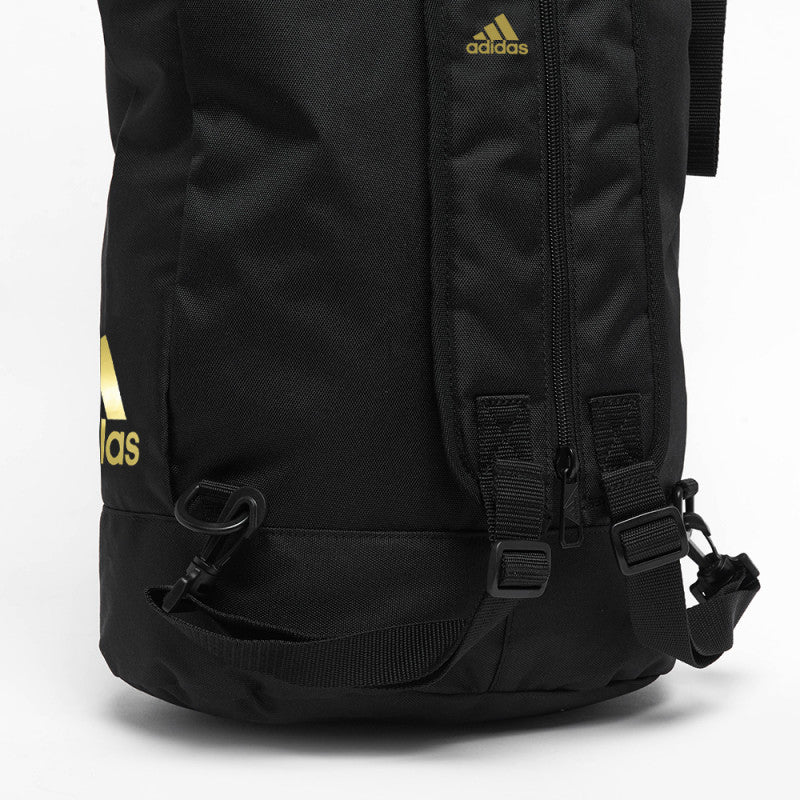 Black Adidas sack bag with yellow logo.