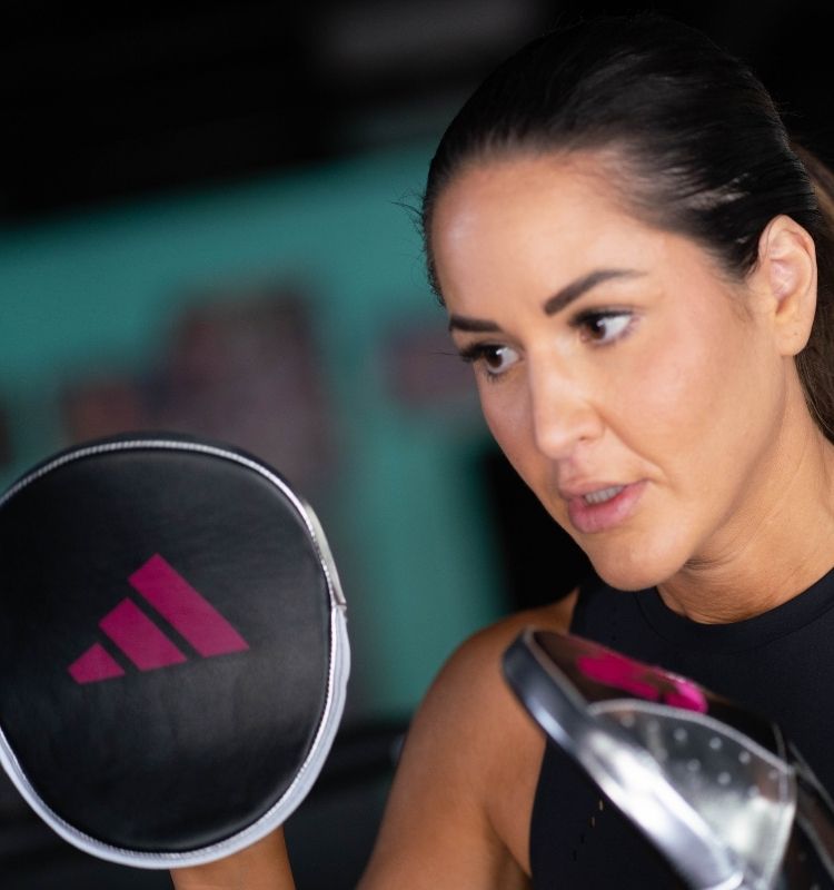 Woman training with the Mitt Queen 