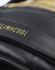 Close-up of a black and gold Adidas glove for boxing.