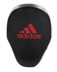 Black boxing glove with red Adidas logo.