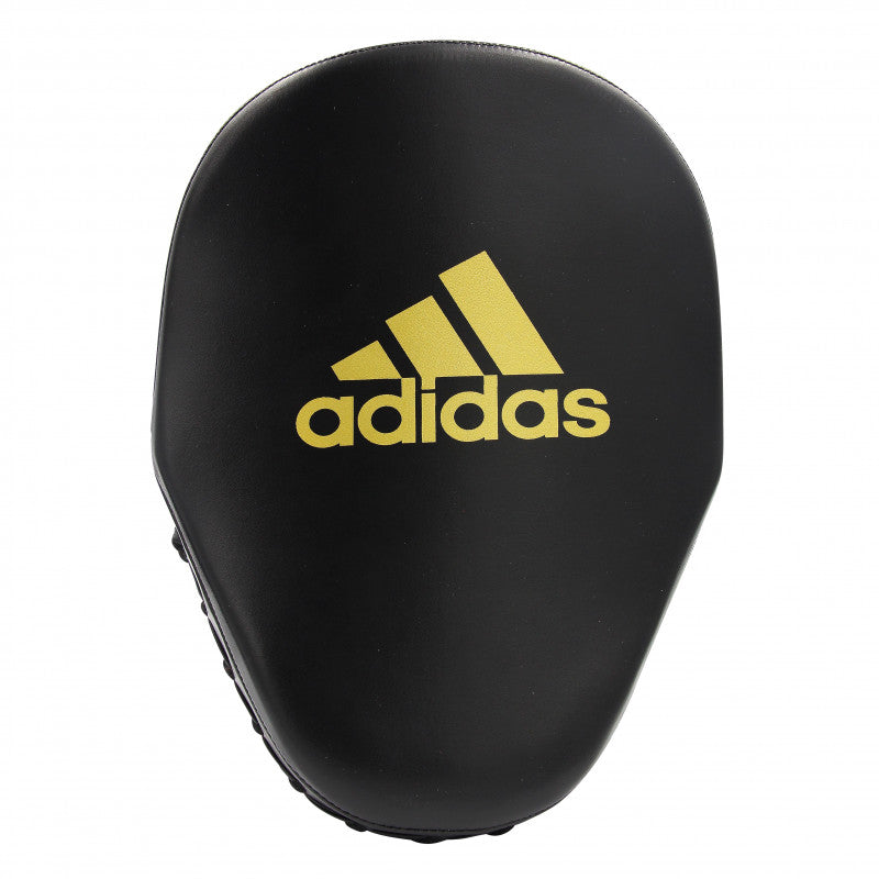 Adidas black focus mitt with yellow logo for boxing training.