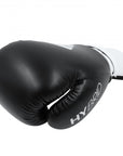 Black Adidas boxing glove with white text.