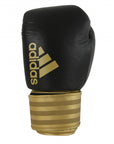 Black and gold boxing glove, adidas Hybrid 200.