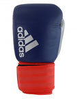 Blue and red boxing glove for kickboxing by Adidas.