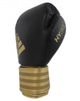 Black and gold boxing glove, adidas Hybrid 200.