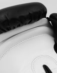 Close-up of adidas Hybrid 50 boxing glove in black and white.