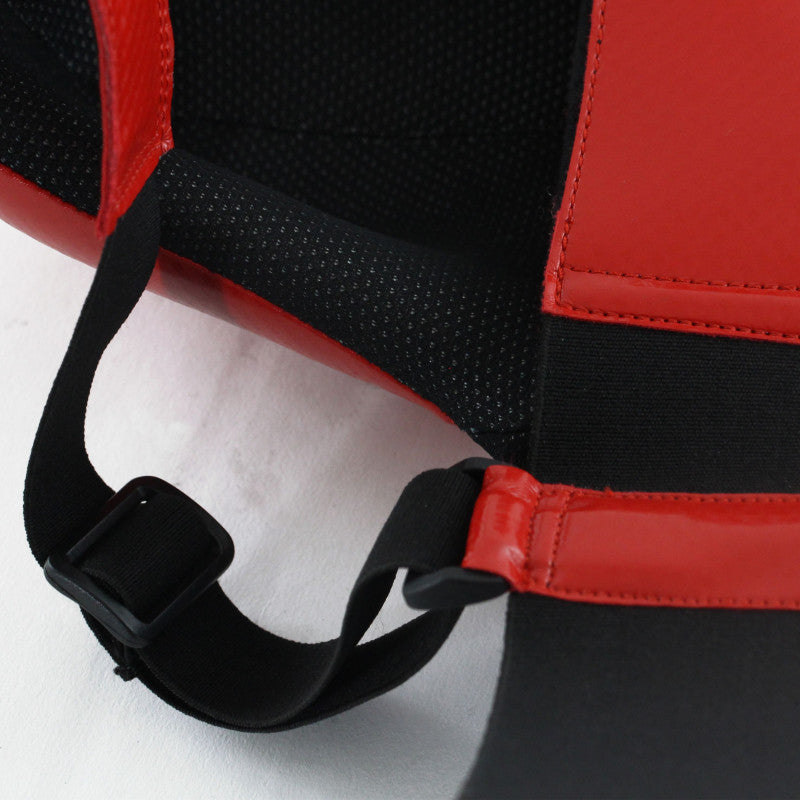 Close up of a red and black Adidas boxing groin guard.