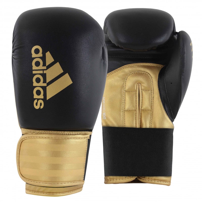 A pair of Adidas Hybrid 100 boxing gloves, black and red, 12 oz weight.