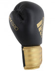 Adidas Hybrid 100 black and gold boxing glove, 12 oz, for men and women.