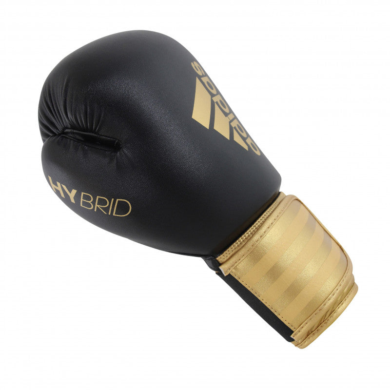 Adidas Hybrid 100 black and gold boxing glove, 10 oz, for men and women.