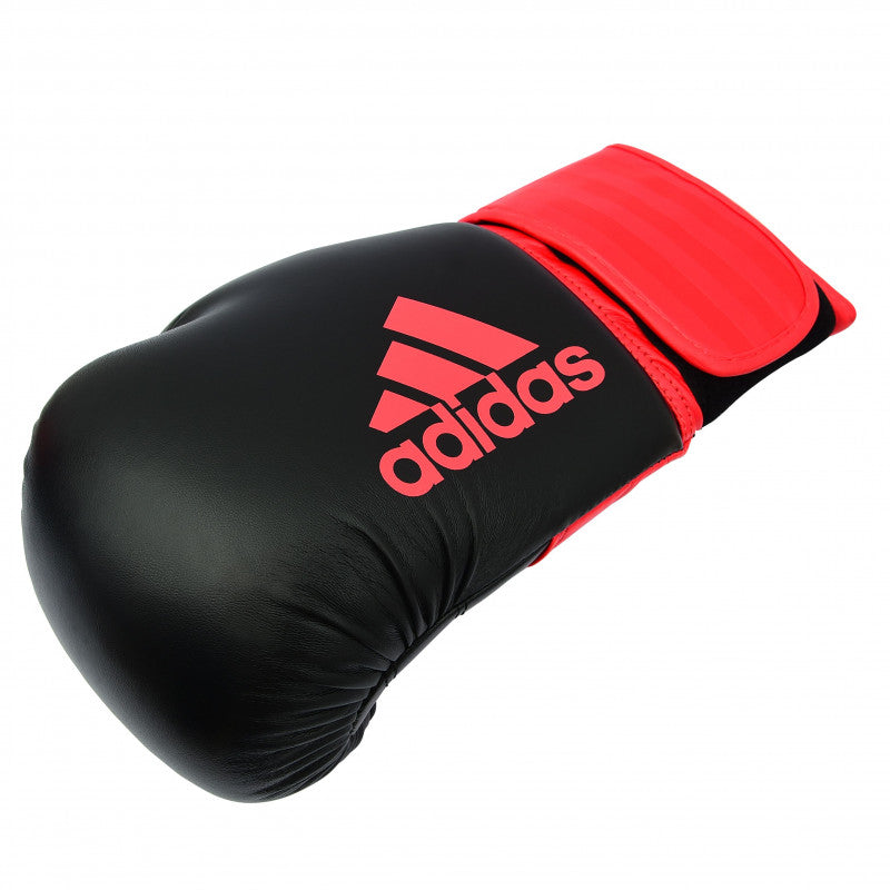 Black and red adidas Hybrid 100 boxing glove.