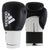 A pair of boxing gloves, Adidas Hybrid 100, in black and gold, 12 oz weight.