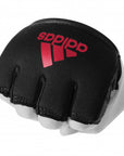 Black glove with red logo for boxing knuckle protection.