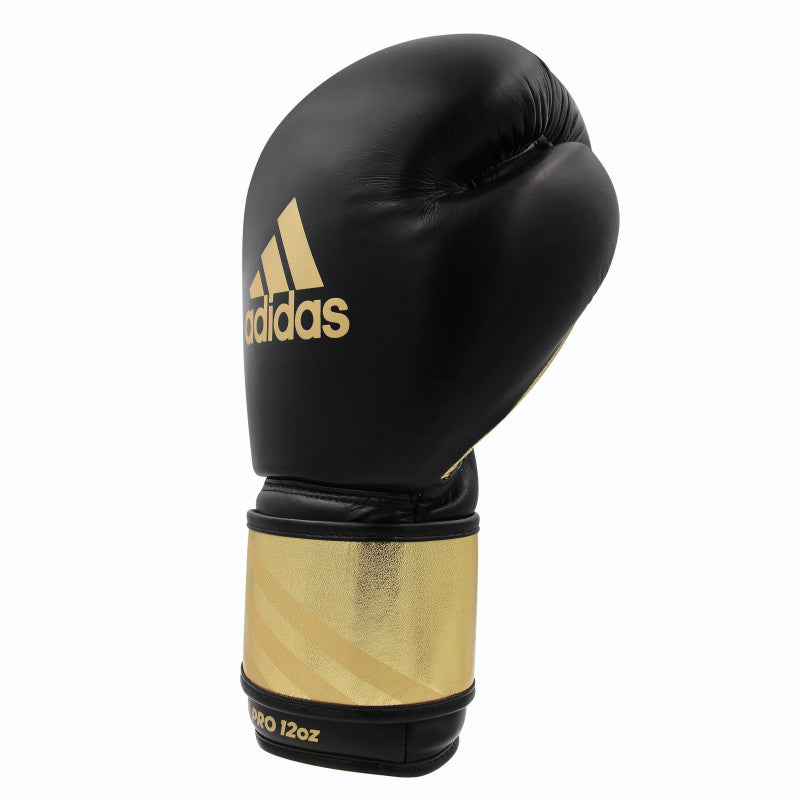 Black and gold boxing glove by Adidas, Adi-Speed 350 Pro model.