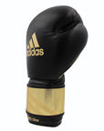 Black and gold boxing glove by Adidas, Adi-Speed 350 Pro model.