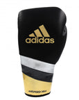 A black and gold boxing glove by adidas, 12 oz, for professional use.